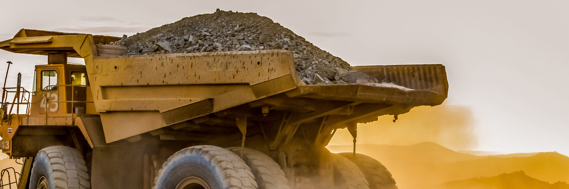 /uploads/media/hero_small_desktop_slide/01/801-large-truck-carrying-sand-platinum-mining-site-africa.jpg?v=1-0